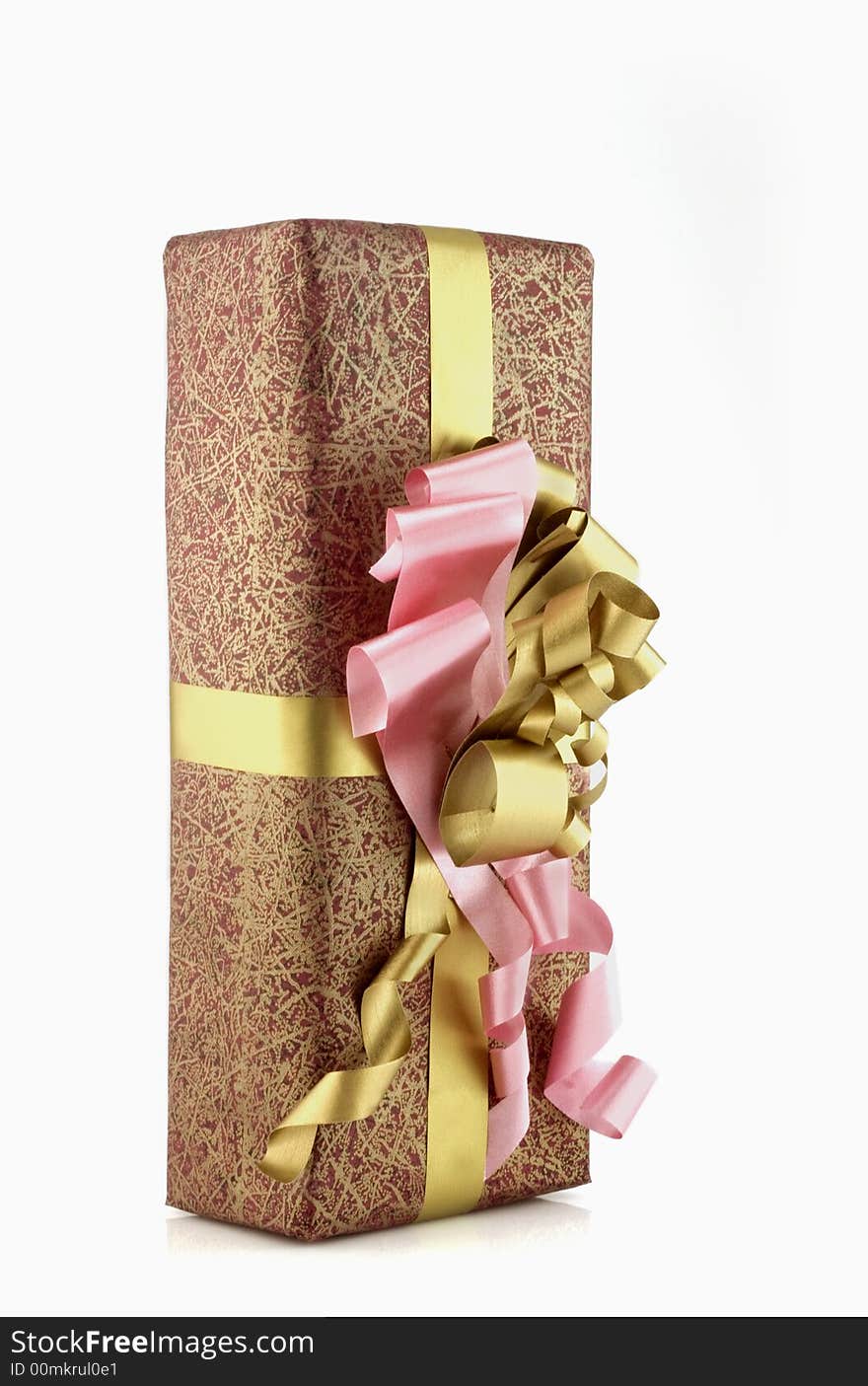 Many-coloured gift box with pink and gold ribbon isolated on white