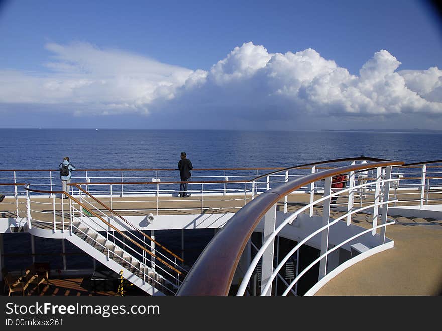 A man on the ship enjoying the fantastic view. A man on the ship enjoying the fantastic view