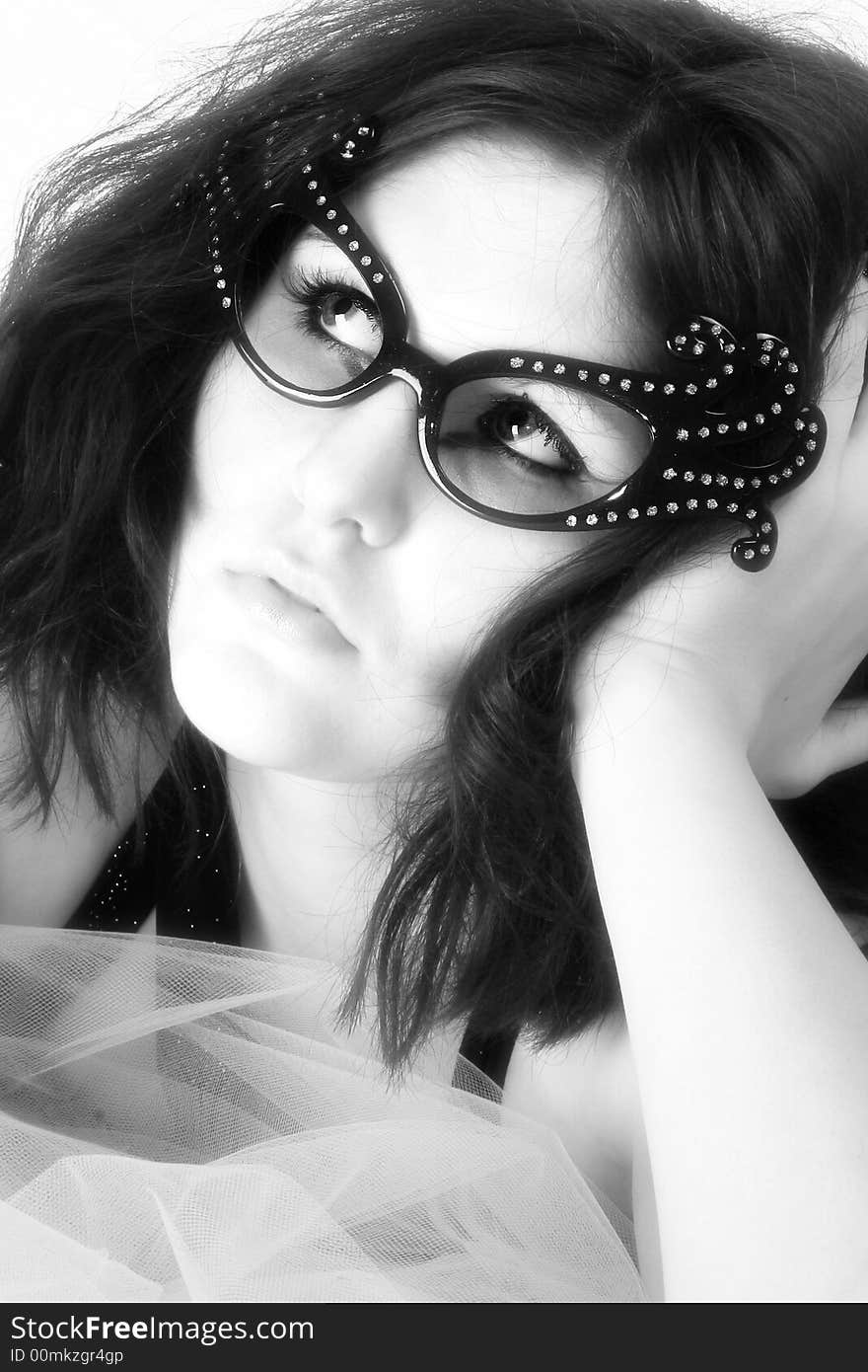 Beautiful young woman with retro glasses.