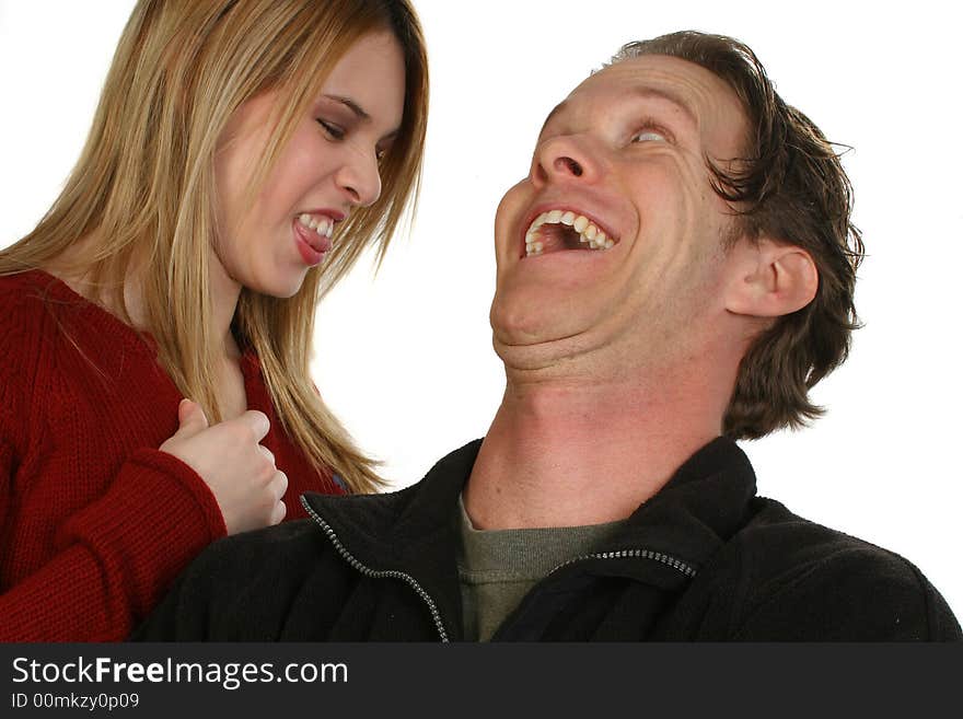 Young couple making silly faces together. Young couple making silly faces together.