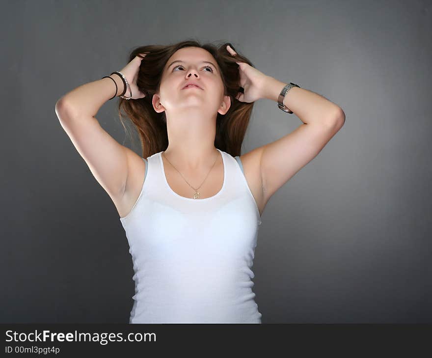 Young woman holding her hair up