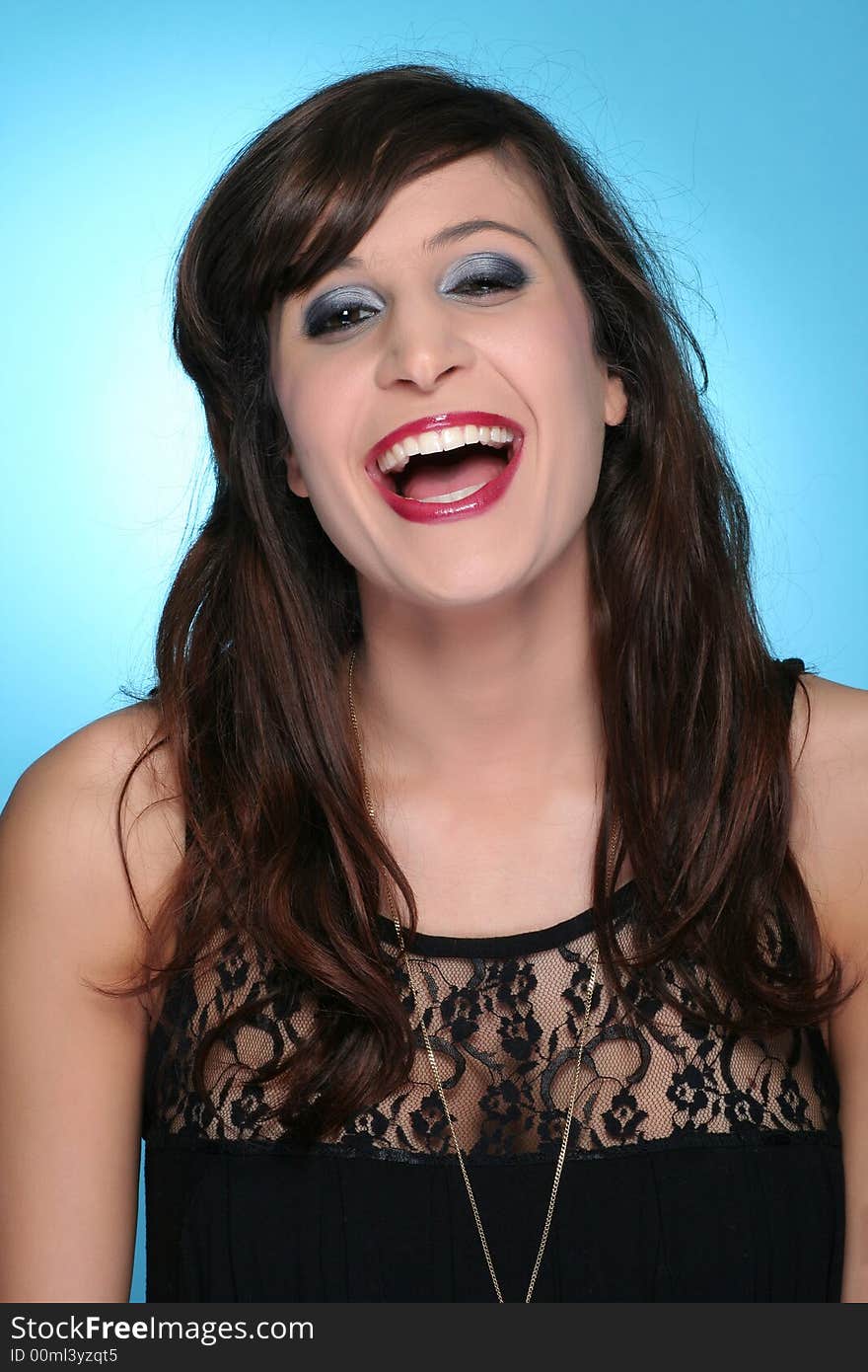 Beautifull woman laughing against blue background. Beautifull woman laughing against blue background