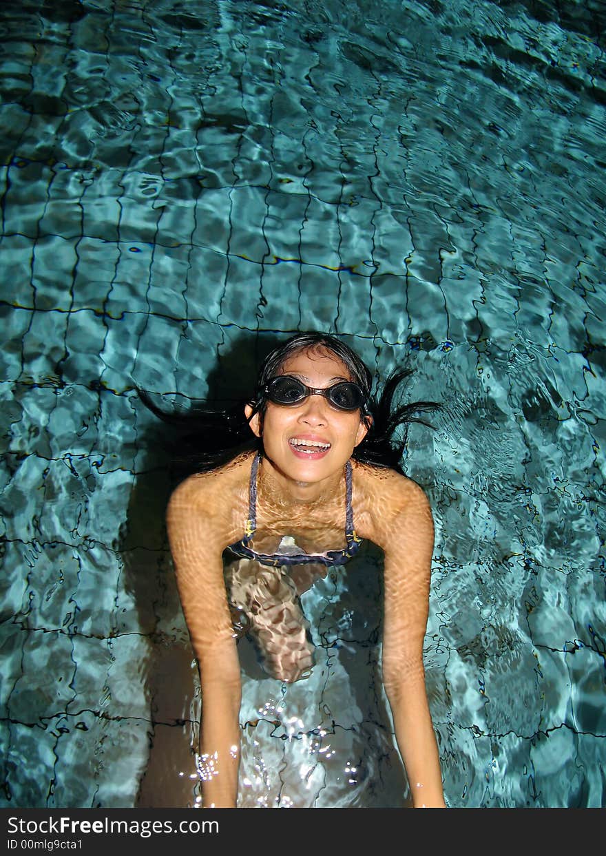 Sport photo, happy girl at the swimming pool at night. Sport photo, happy girl at the swimming pool at night