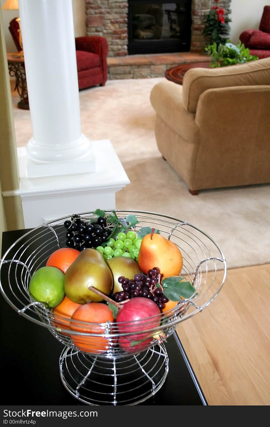 Colorful fruits decorated in a bowl on kitchen counter top. Colorful fruits decorated in a bowl on kitchen counter top