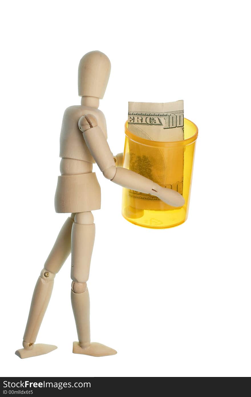 Wooden man carrying a plastic medicine bottle with a one hundred dollar bill and one pill. Wooden man carrying a plastic medicine bottle with a one hundred dollar bill and one pill