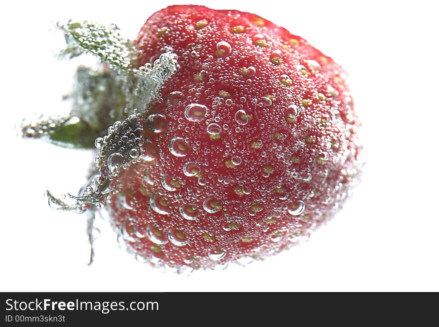 Bright red strawberry on a white background