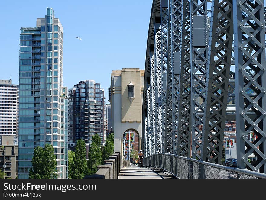 Walking on Vancouver bridge towards Vancouver city downtown (British Columbia, Canada).