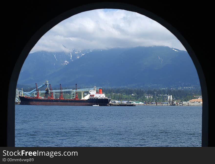 The view to Vancouver bay from the lower part of a lighthouse in Stanley's park (British Columbia, Canada). The view to Vancouver bay from the lower part of a lighthouse in Stanley's park (British Columbia, Canada).