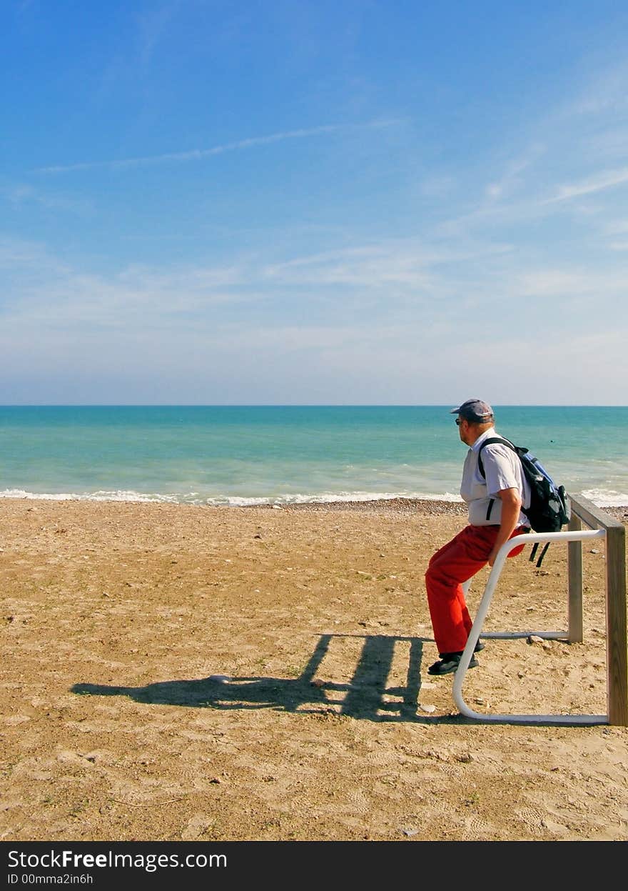 The man relaxing near sea