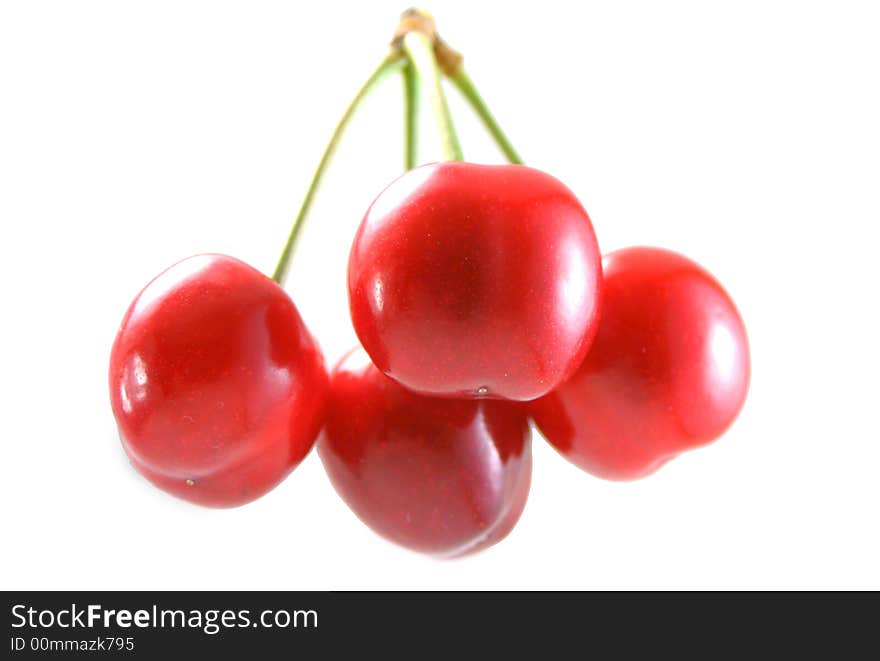 A bunch of cherries on white background