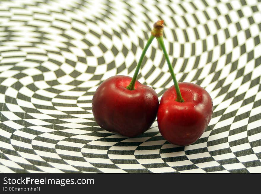 Delicious cherries on an abstract black and white background