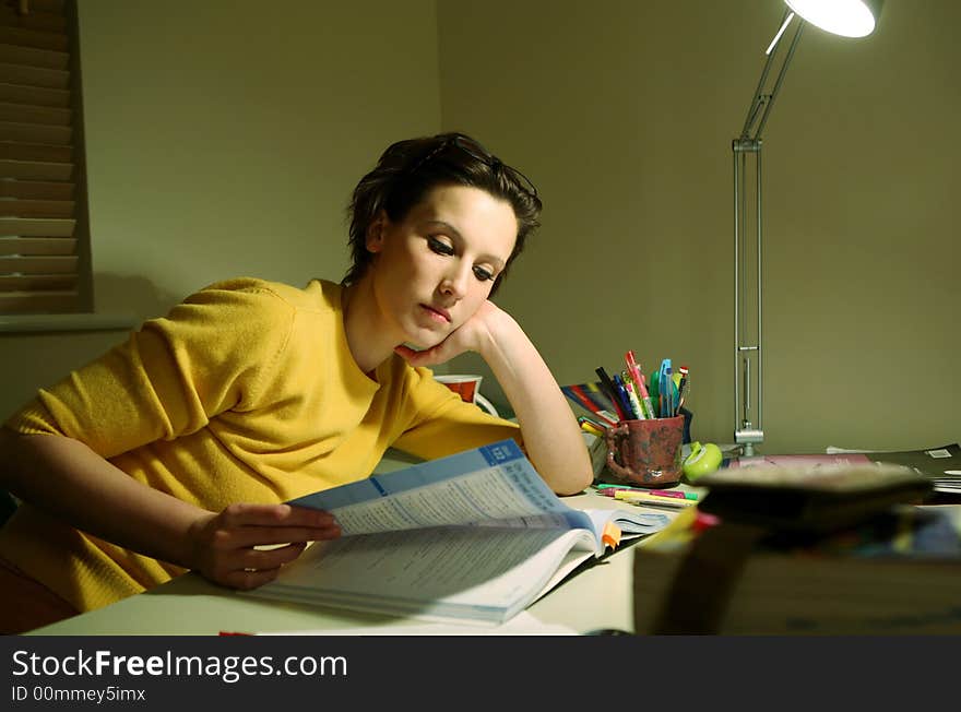 Young student at a desk preparing for an exam. Young student at a desk preparing for an exam