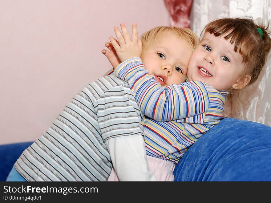 The boy in embraces of the girl. Children age 2 years. The boy in embraces of the girl. Children age 2 years