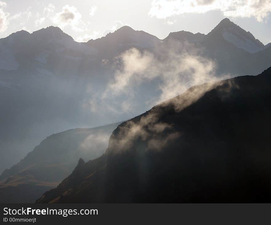 Sihouette of mountains with light clouds