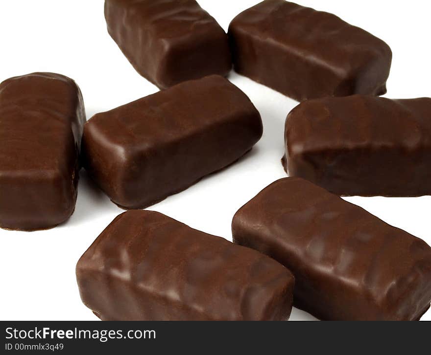 Many chocolates on white background