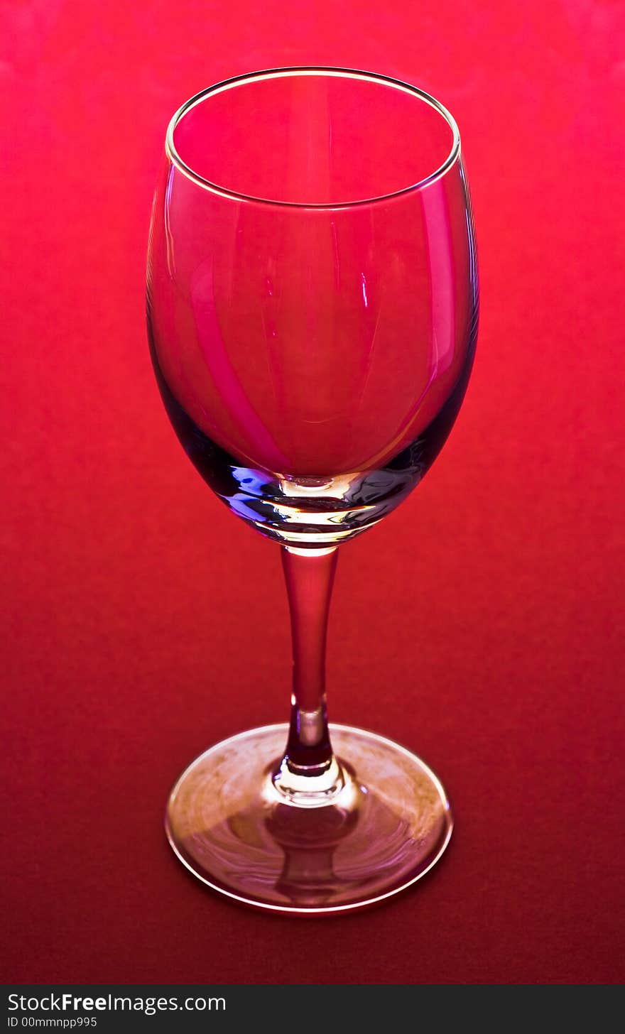 The close up of the red wine glass