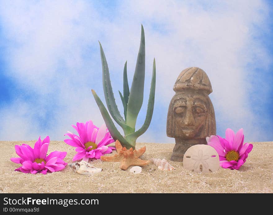 Aloe Plant and Statue on Sand With Blue Sky Background. Aloe Plant and Statue on Sand With Blue Sky Background