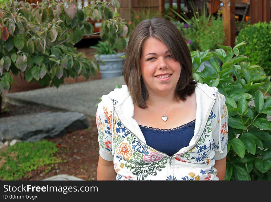 Teenager posing in garden