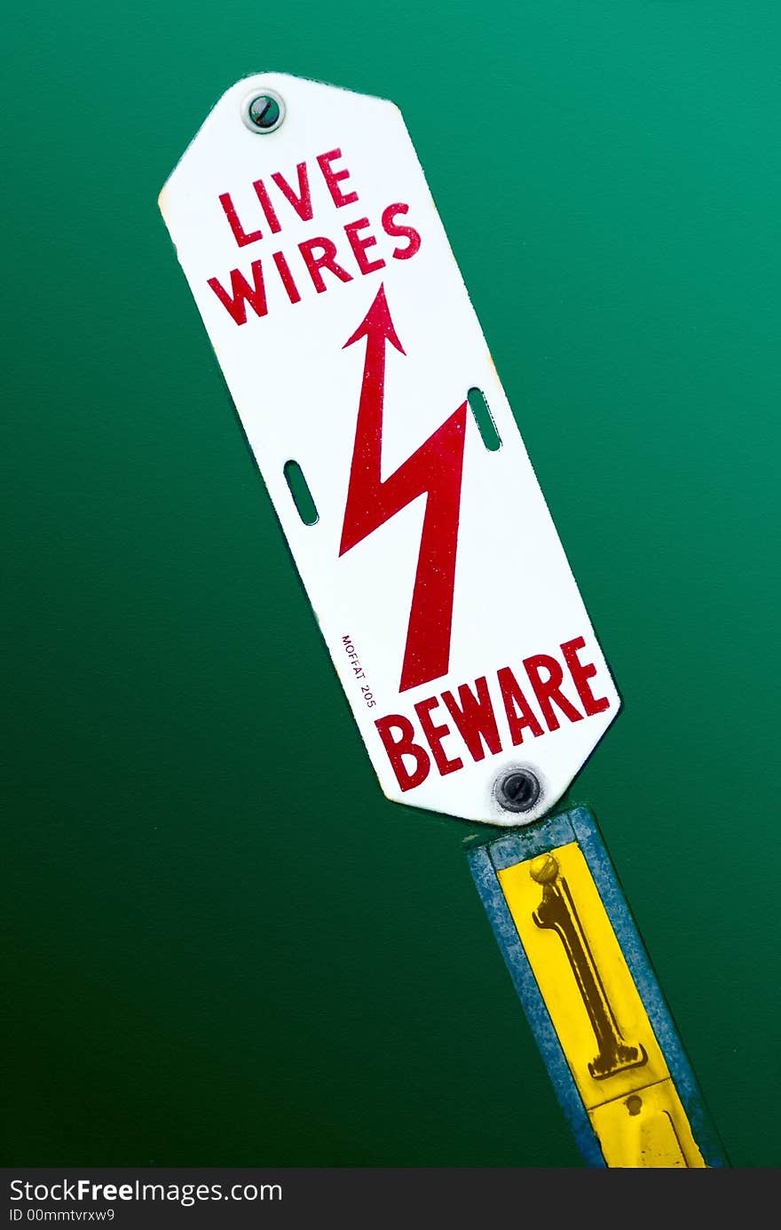 Electric Danger Sign On Green