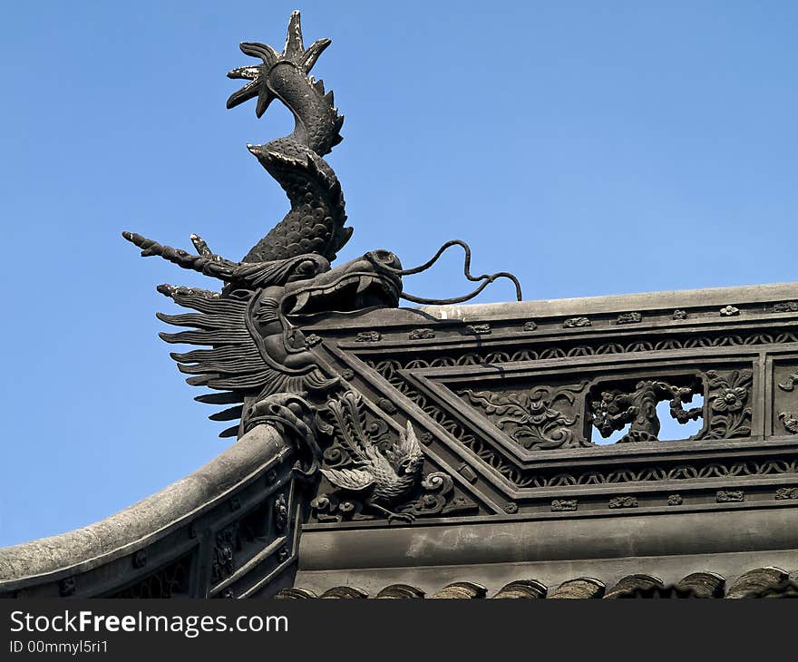 Edge of a chinese temple roof with little figures on it. Edge of a chinese temple roof with little figures on it