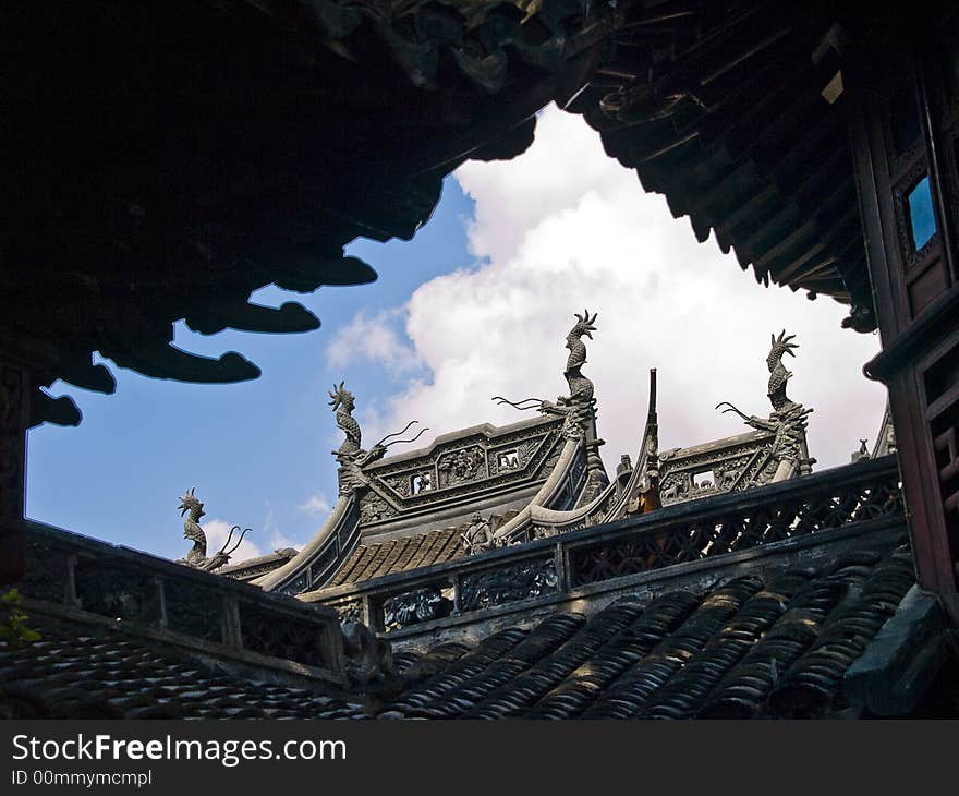 Edge of a chinese temple roof with little figures on it. Edge of a chinese temple roof with little figures on it