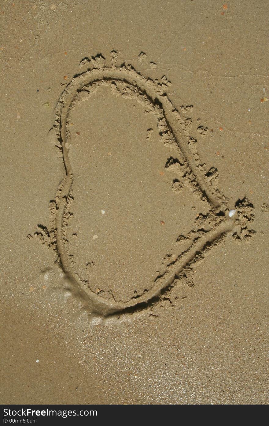 Heart shape on the sand beach. Heart shape on the sand beach