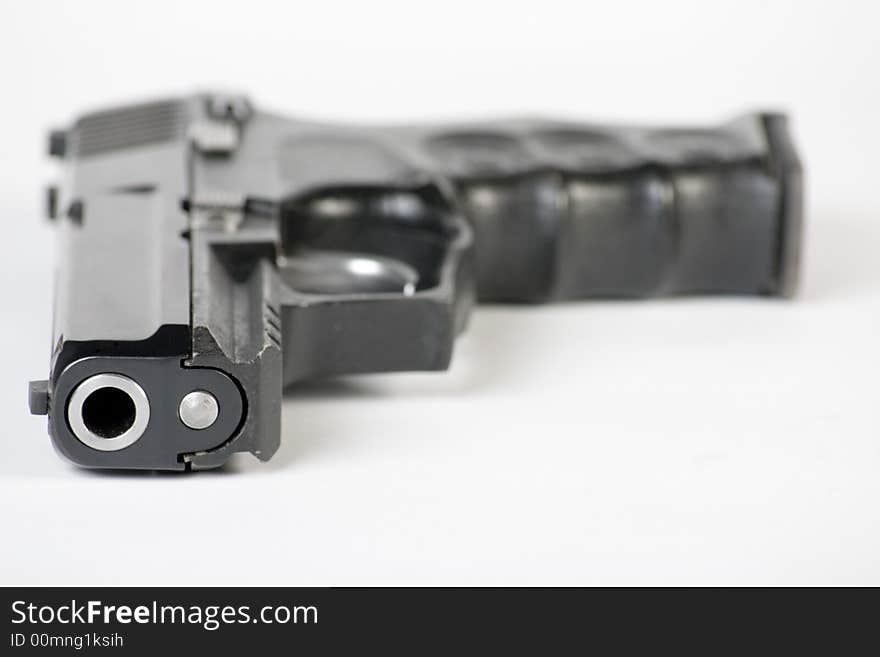 Close up of handgun on white background