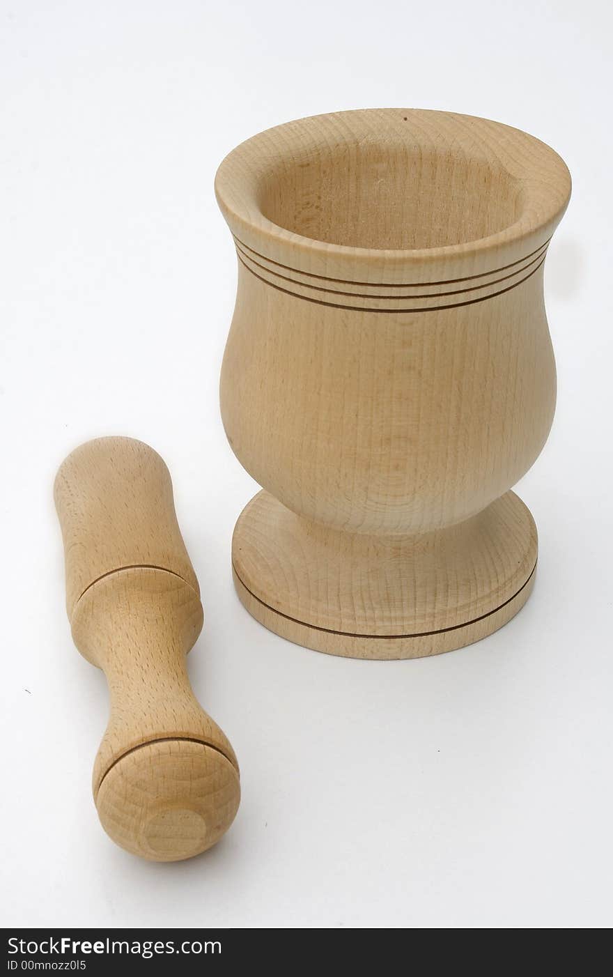 Wooden pestle on white background