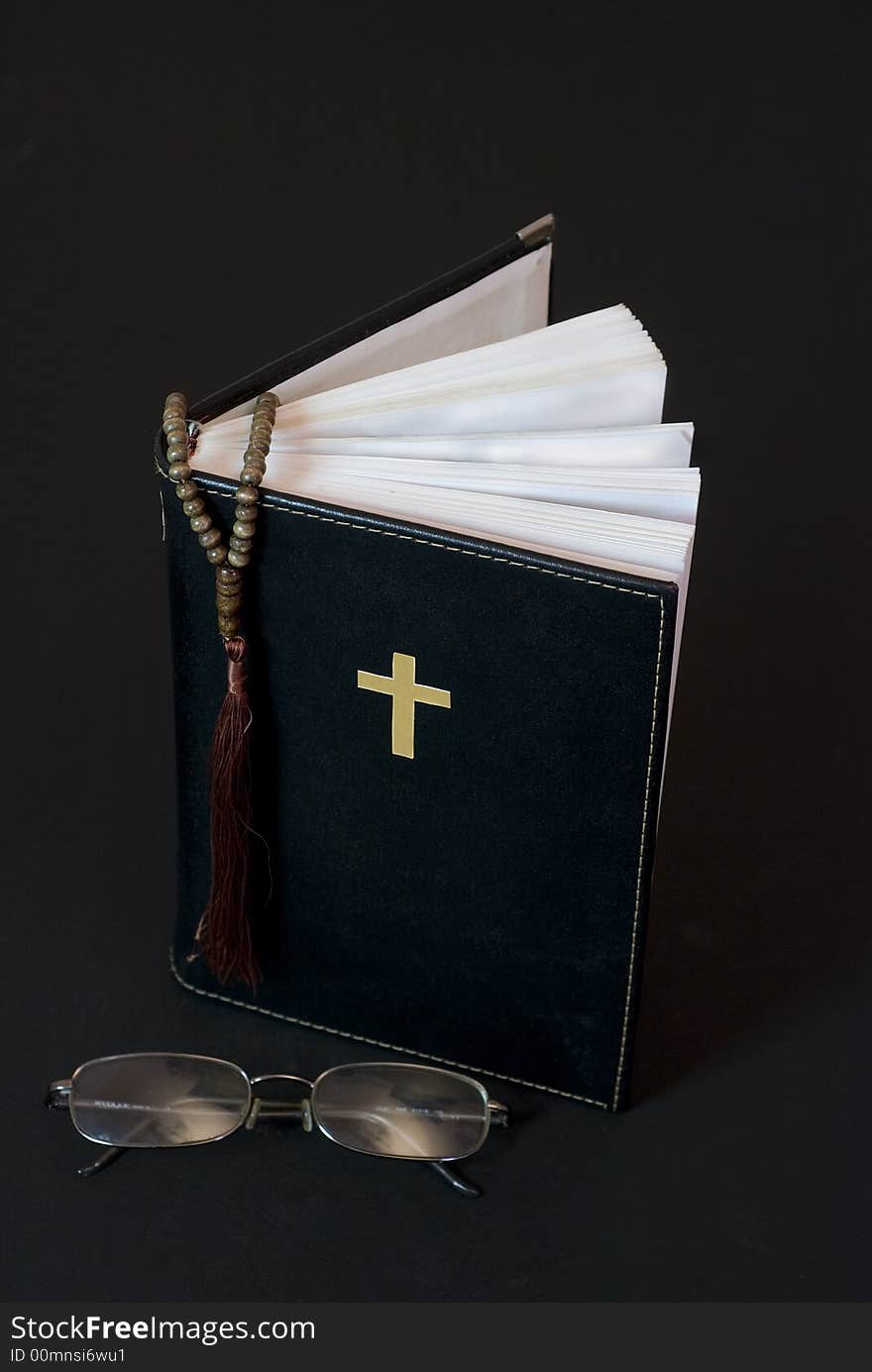 Holy bible with glasses and dark background. Holy bible with glasses and dark background