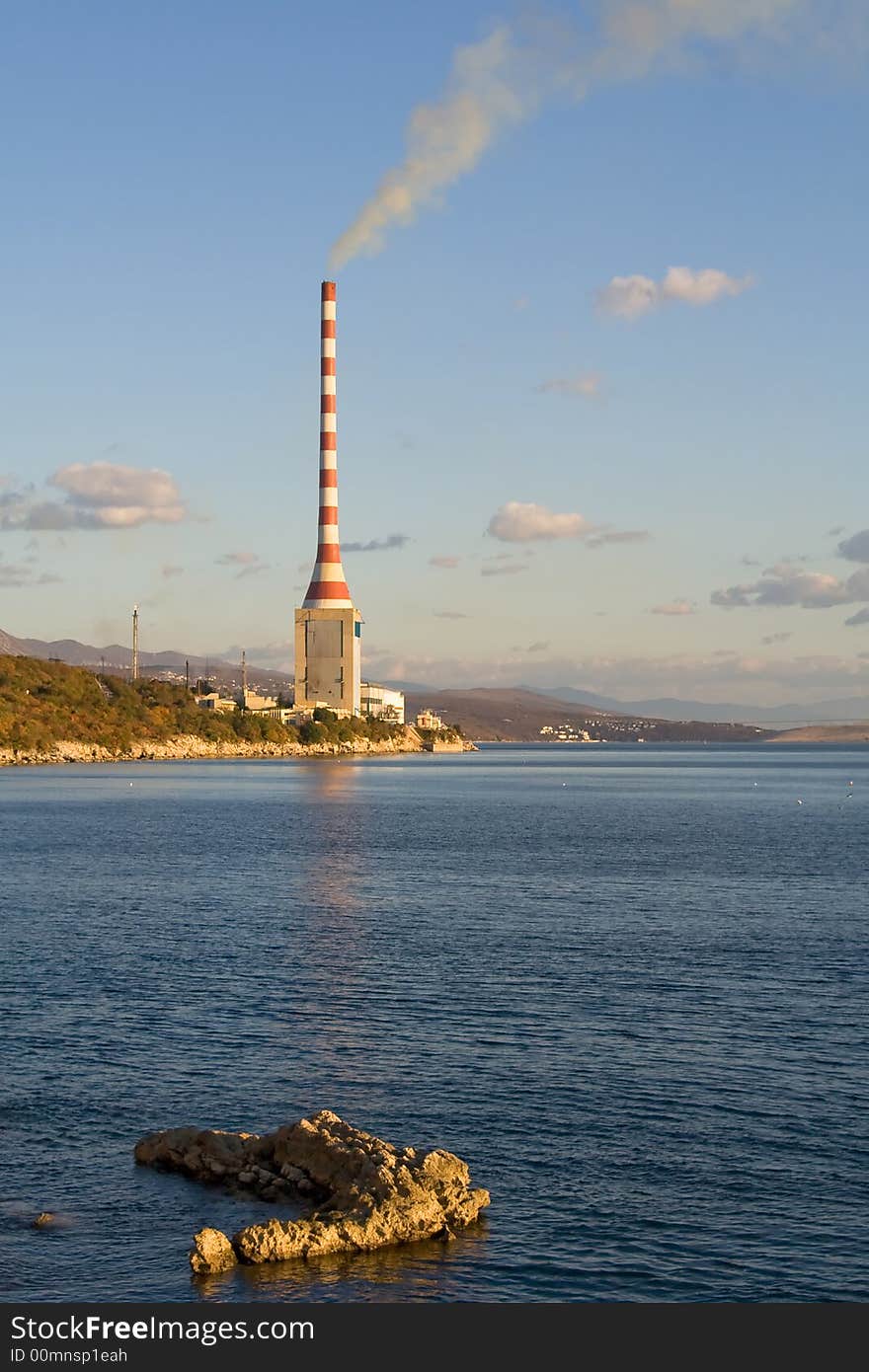 Hydroelectric plant with sky and clouds in the background. Hydroelectric plant with sky and clouds in the background