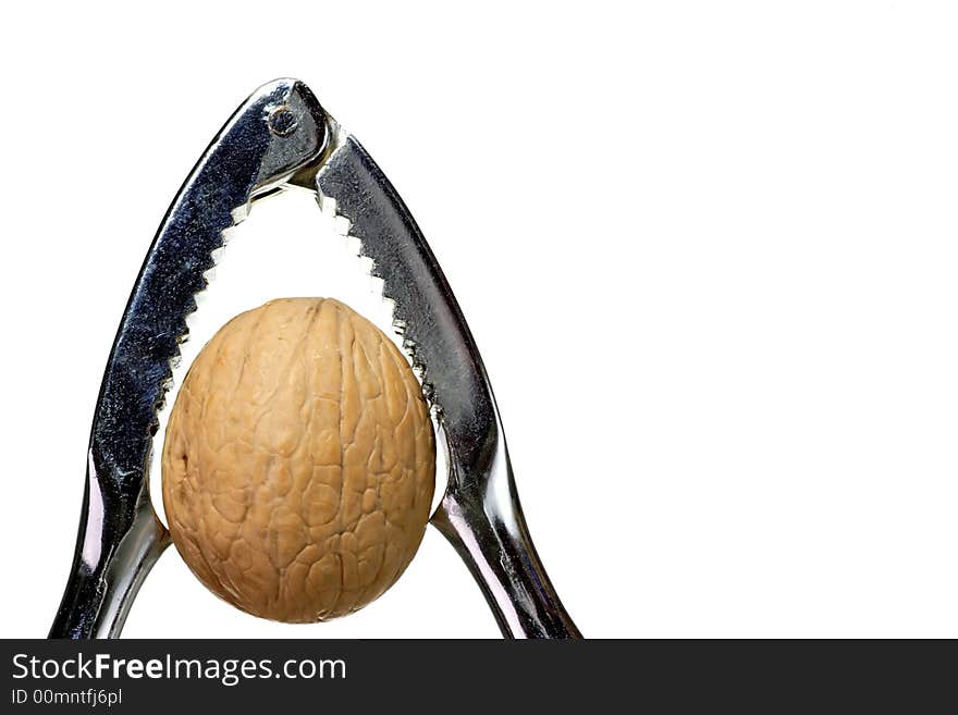 Walnut with nutcracker, isolated on white background