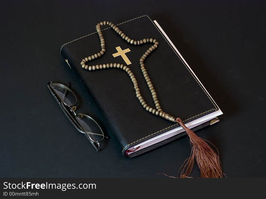 Holy book Bible on the ground with black background. Holy book Bible on the ground with black background