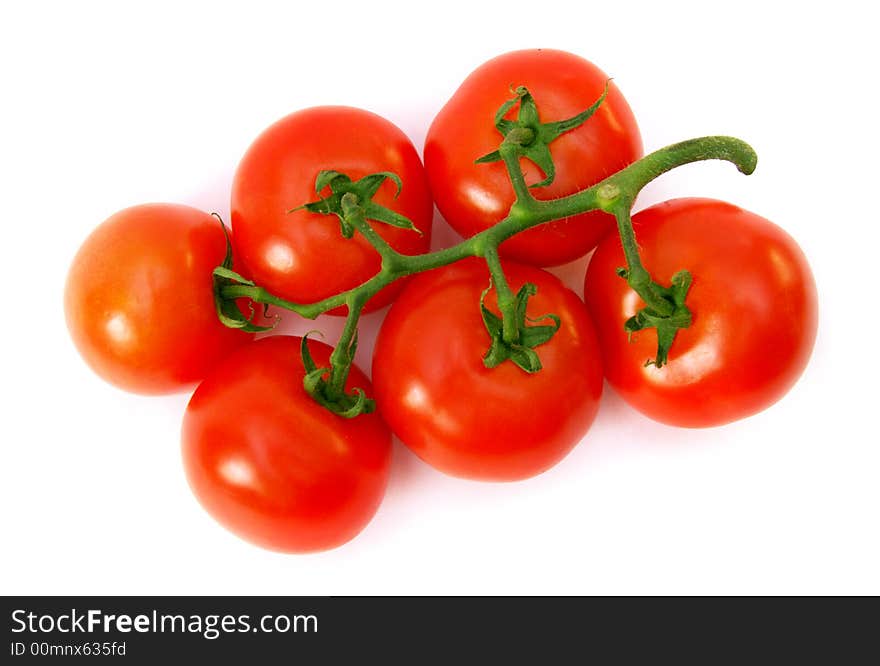 A lot of red tomatoes is on a white background.