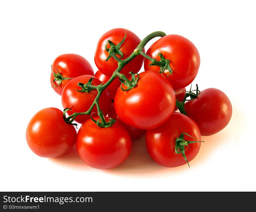 A lot of red tomatoes is on a white background.