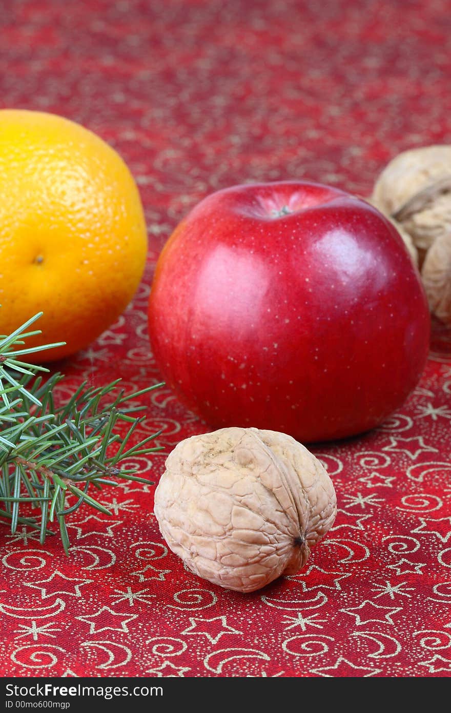 Christmas still life with apples and walnuts