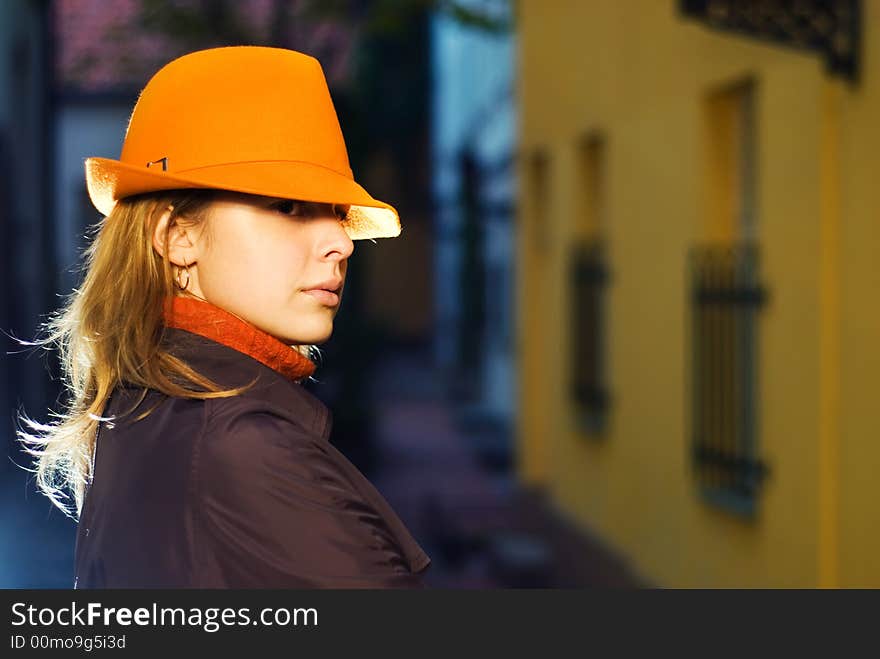 Beautiful redhead girl in european old city