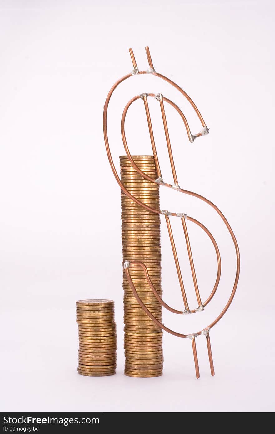 Piles of yellow coins and dollar sign against white background. Piles of yellow coins and dollar sign against white background.