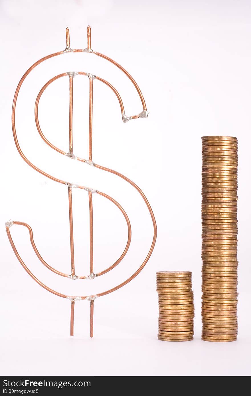 Piles of yellow coins and dollar sign against white background. Piles of yellow coins and dollar sign against white background