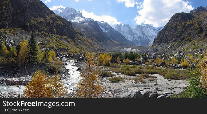 Autumn at bottom of high mountains. Autumn at bottom of high mountains