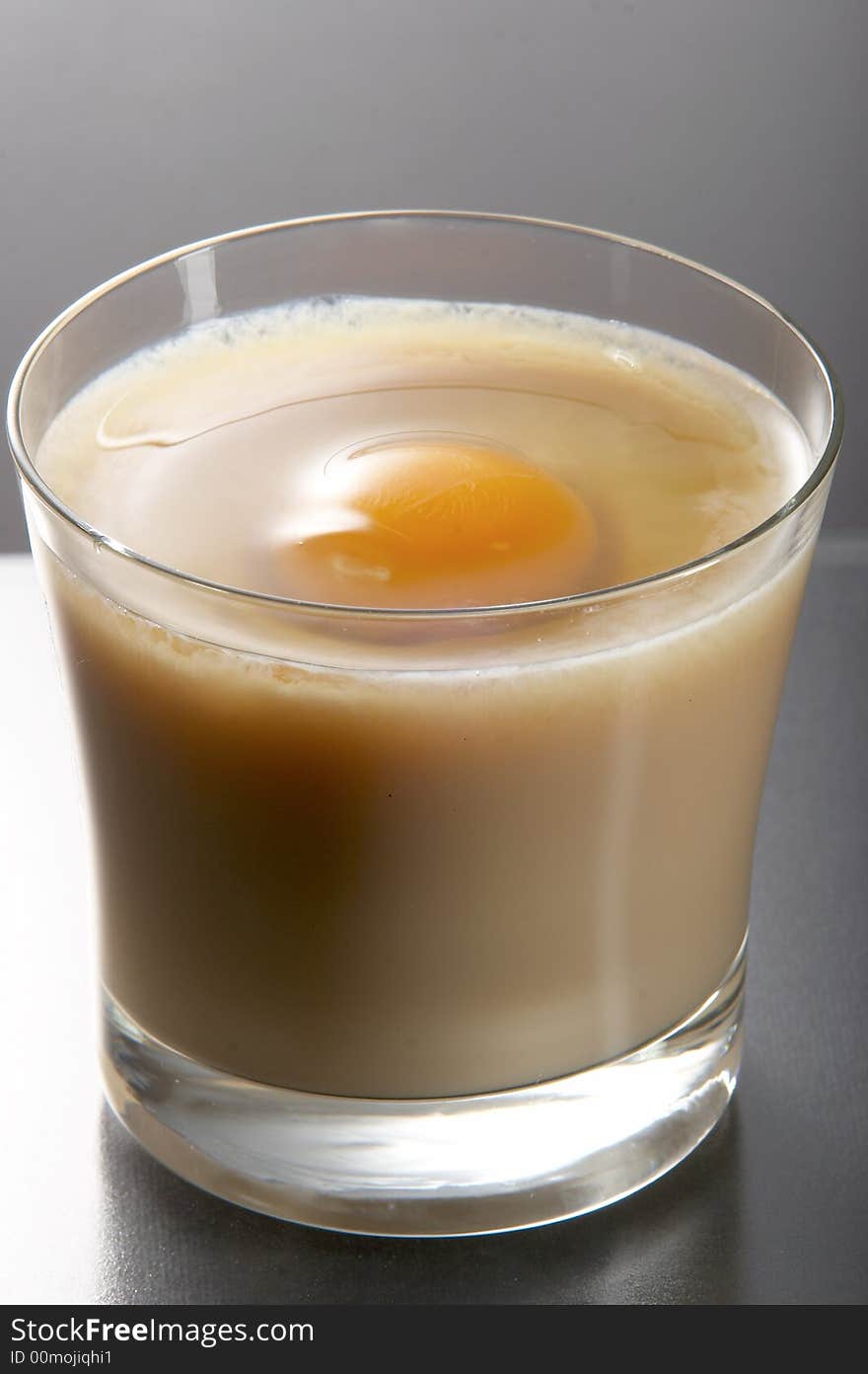 Liqueur in glass on the white background