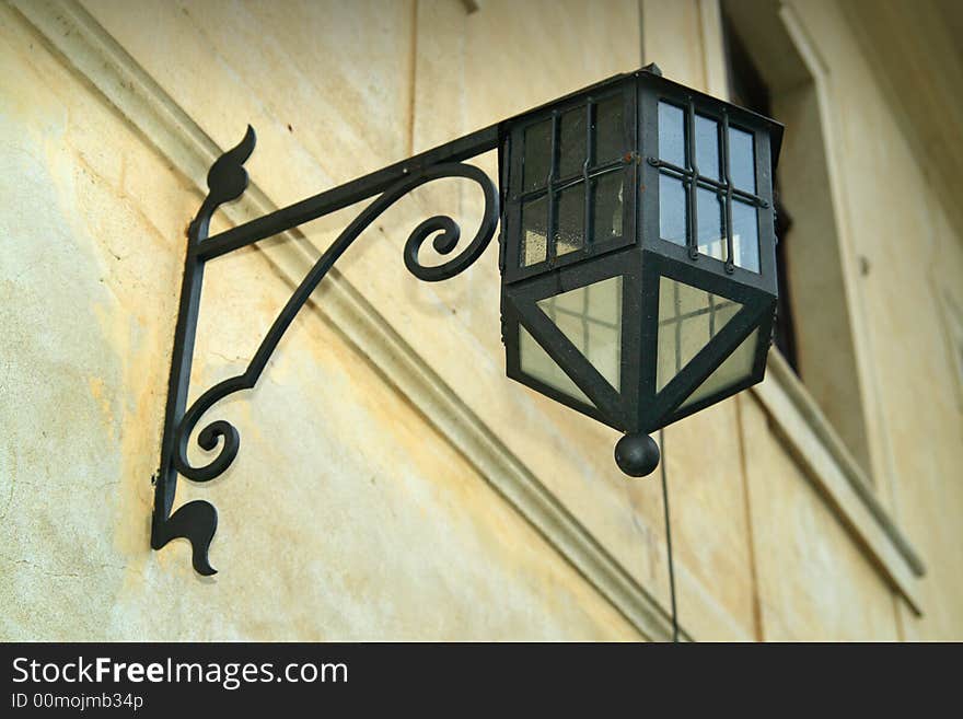 Old street lamp hanging on a wall