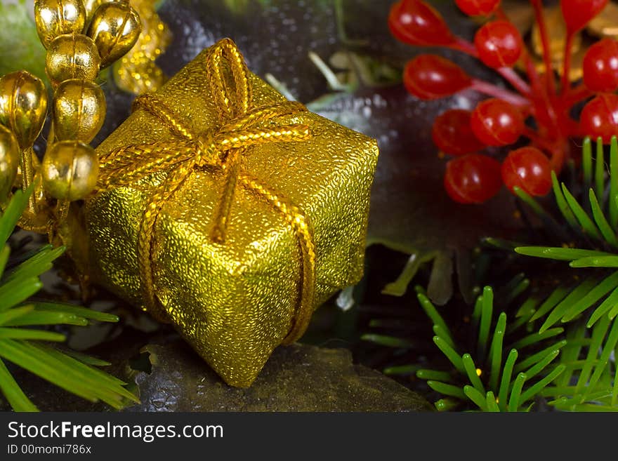 Gold gift, close-up, christmas background. Gold gift, close-up, christmas background