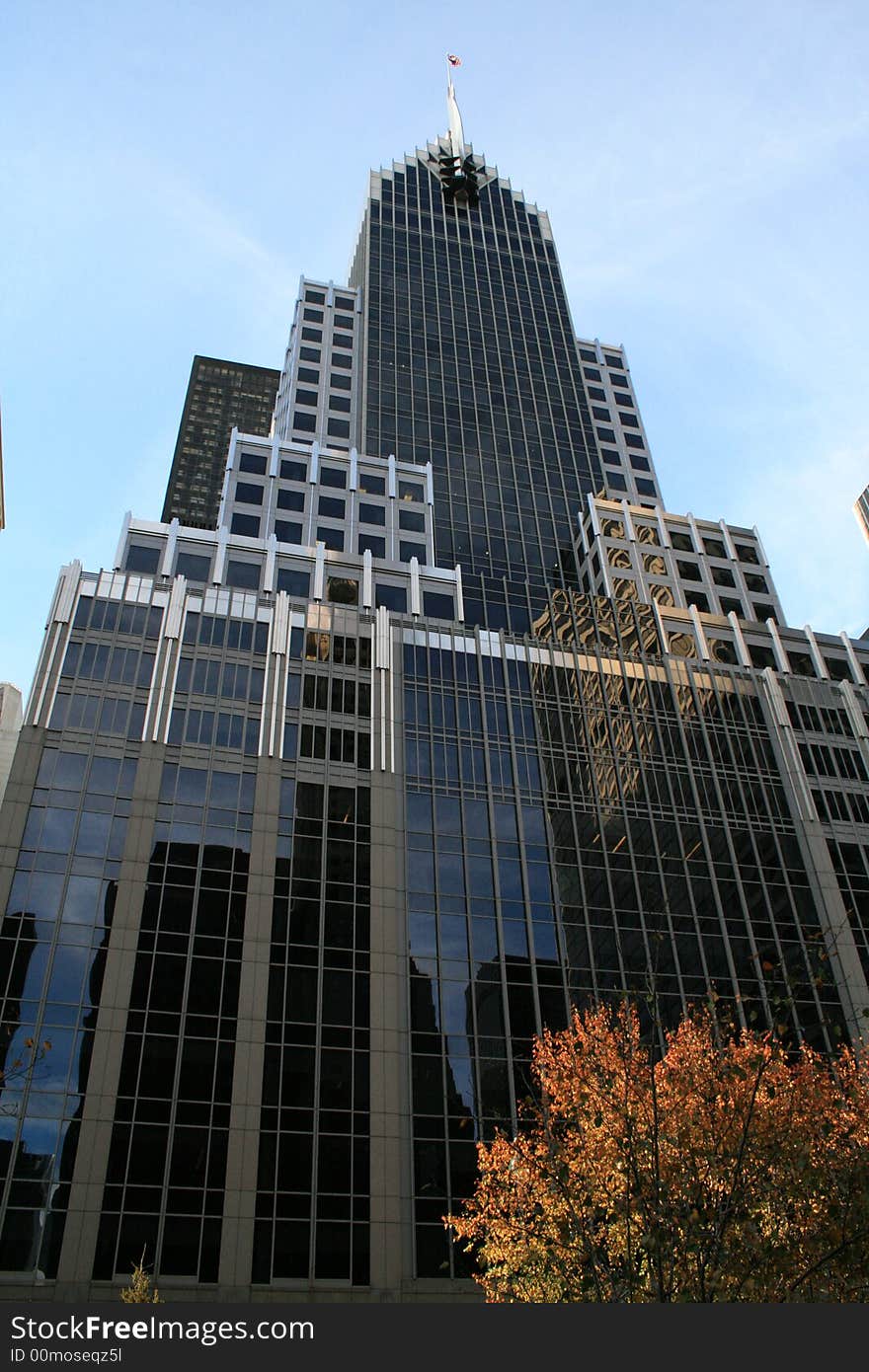 A look up at one of the many skyscrapers that dominate midtown Manhatten in New York City. A look up at one of the many skyscrapers that dominate midtown Manhatten in New York City