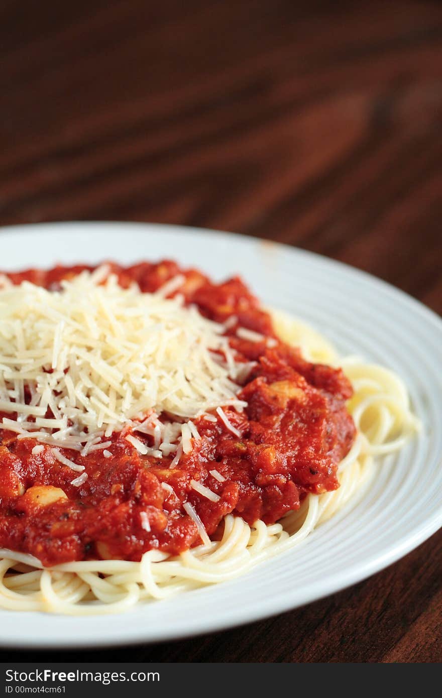 Portrait view of seafood pasta on a wooden table