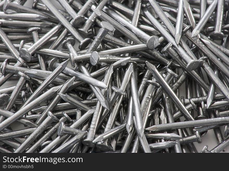 Closeup of a pile of steel nails.