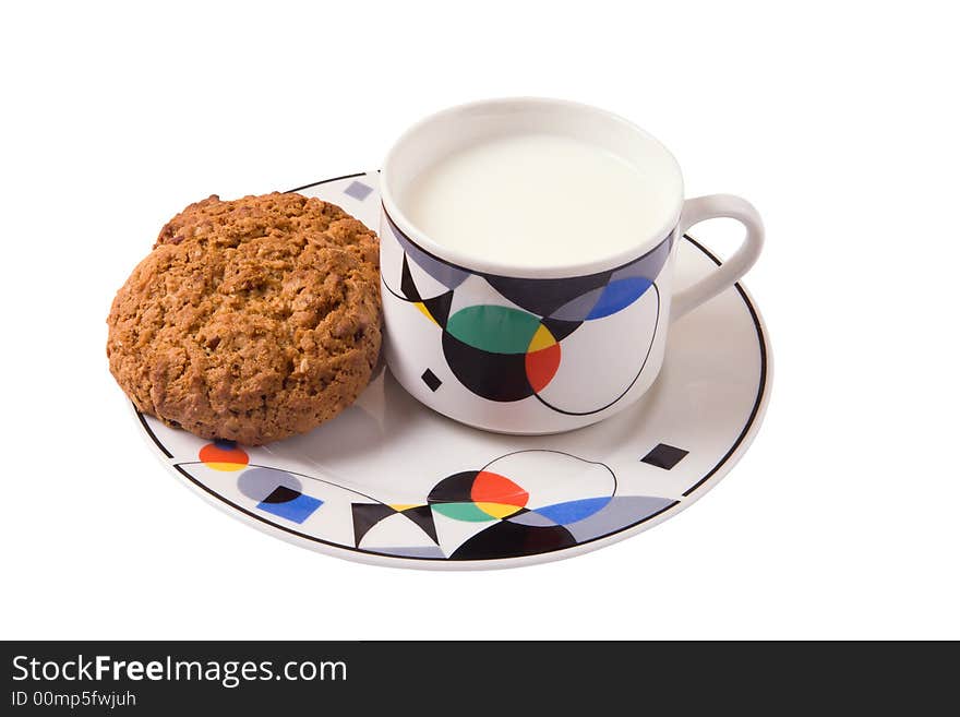 Milk and cookies on plate isolated