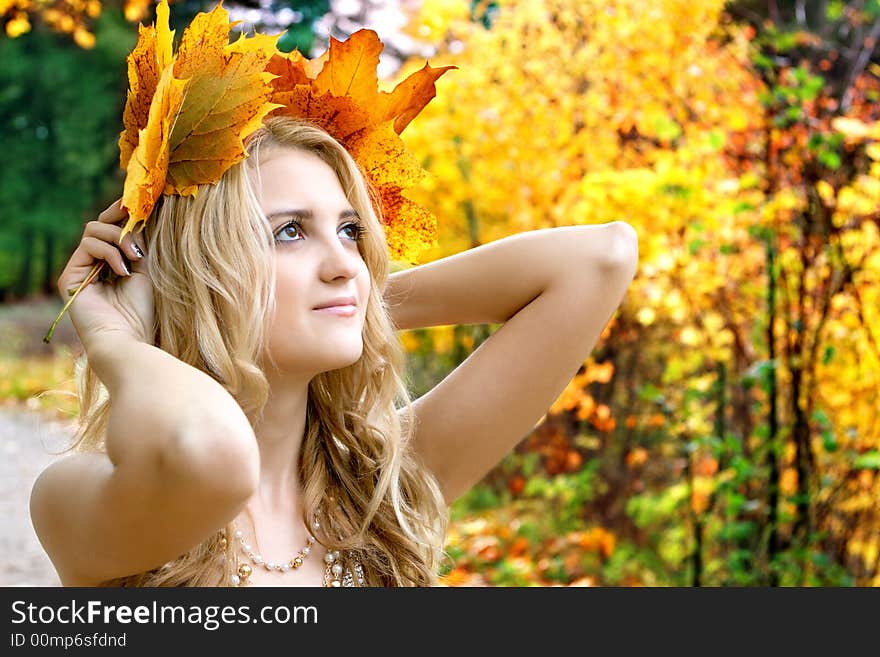 Portrait of beautiful girl in autumn park with leaves. Portrait of beautiful girl in autumn park with leaves