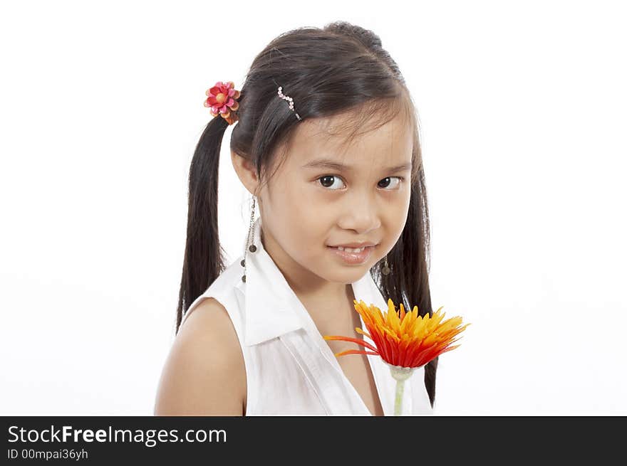 A young girl holding a flower over a white background. A young girl holding a flower over a white background