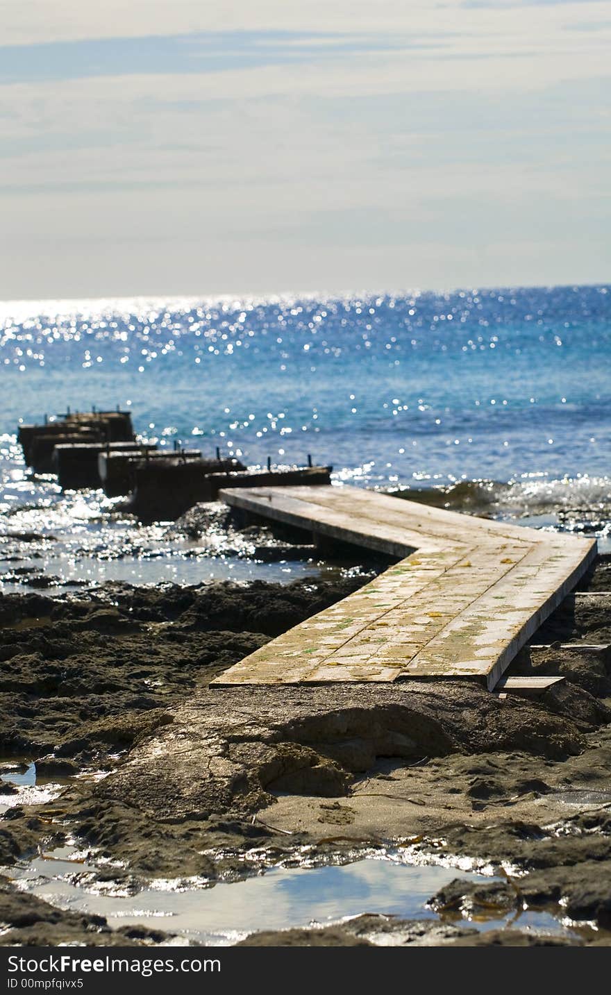 Cat-walk into the blue sea. Es Cavallet Ibiza, Spain. Cat-walk into the blue sea. Es Cavallet Ibiza, Spain