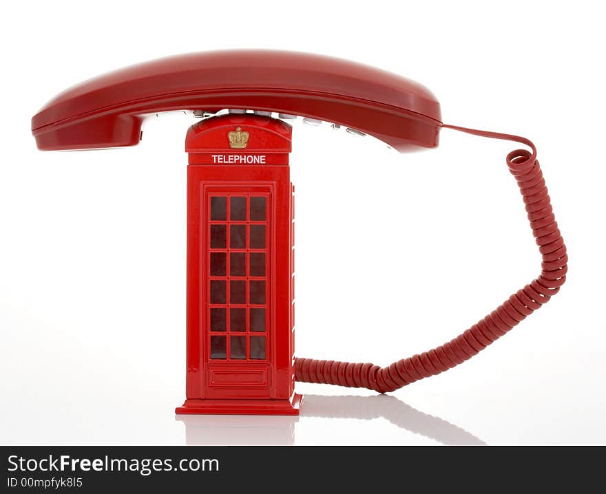 Photo of a red telephone over a white background